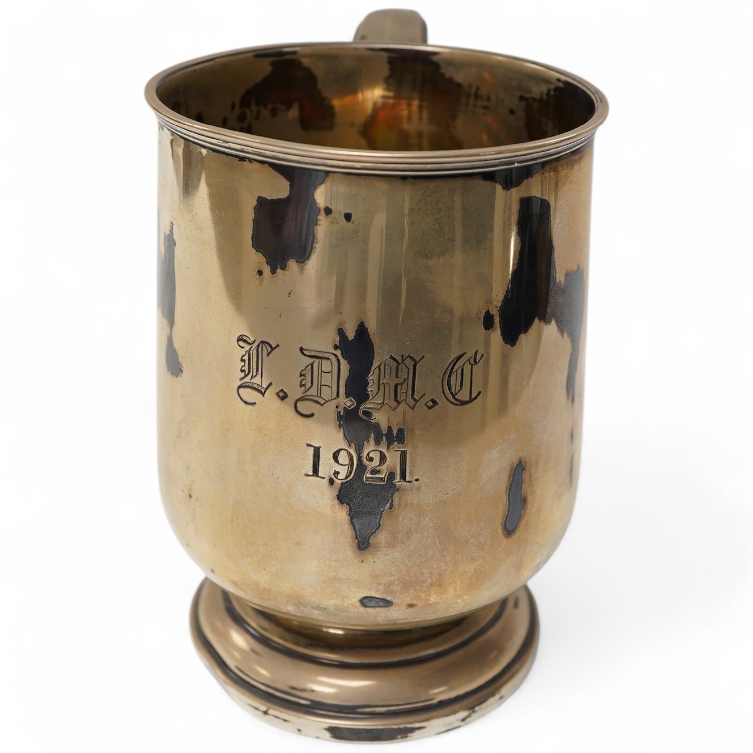 A George V silver mug by Walker & Hall, Sheffield, 1921, on a circular foot, height 12.5cm, 9.5oz.